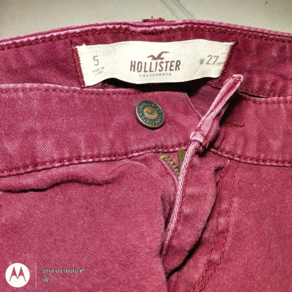 Burgundy Hollister skinny jeans.